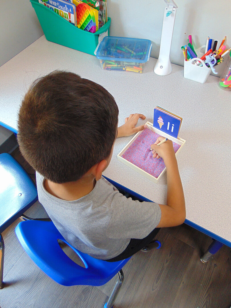 Child at table doing Autism testing